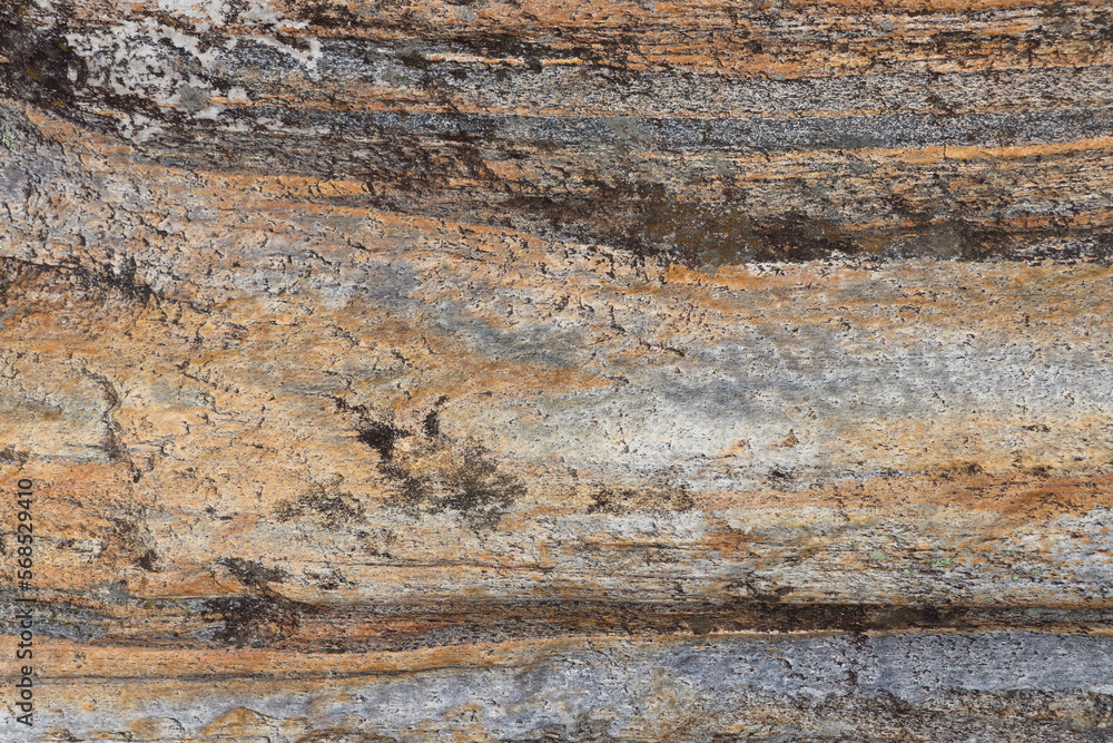 Gold brown and grey stone patterns with stripes from riverbed of Vale Verzasca in Switzerland Gold brown and grey stone patterns with stripes from riverbed of Vale Verzasca in Switzerland