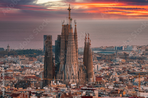 Beautiful aerial view of the Barcelona city with a Sagrada Familia cathedral standing in the city center.