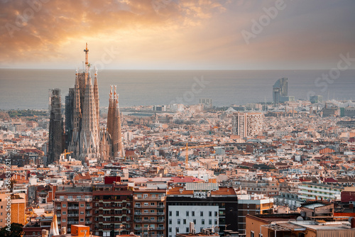 Beautiful aerial view of the Barcelona city with a Sagrada Familia cathedral standing in the city center. © Aerial Film Studio