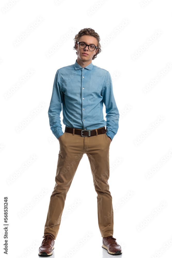 casual man putting his hands in pockets with wide feet casual man putting his hands in pockets with wide feet