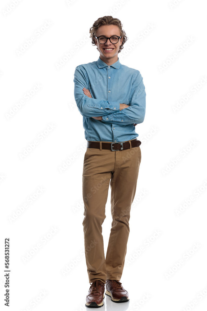 casual man crossing arms and smiling at the camera casual man crossing arms and smiling at the camera