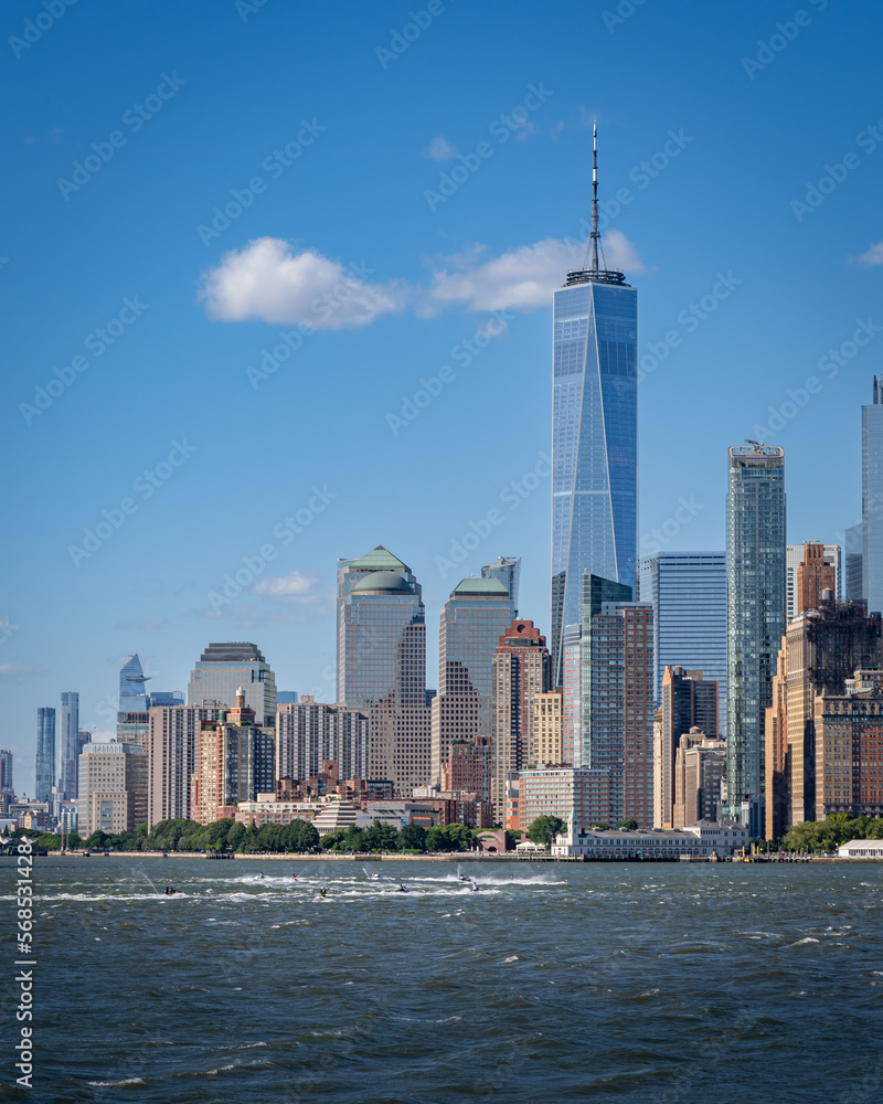 Freedom tower and lower Manhattan panorama from a ferry on the Hudson river on a summer day 2