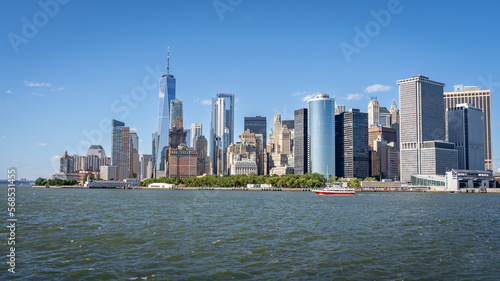 Battery Park, Freedom tower and lower Manhattan panorama from a ferry on the Hudson river on a summer day