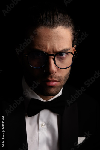 serious elegant groom with glasses in tuxedo frowning © Viorel Sima