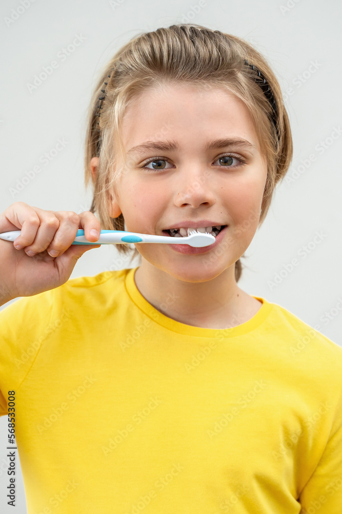 SchoolBoy Brush Teeth Child Looking At Camera Over White Background, Dentistry, Stomatology, Dental Care Hygiene With Toothbrush Toothpaste, Morning Evening Routine, Lifestyle, Health Care. Vertical SchoolBoy Brush Teeth Child Looking At Camera Over White Background, Dentistry, Stomatology, Dental Care Hygiene With Toothbrush Toothpaste, Morning Evening Routine, Lifestyle, Health Care. Vertical