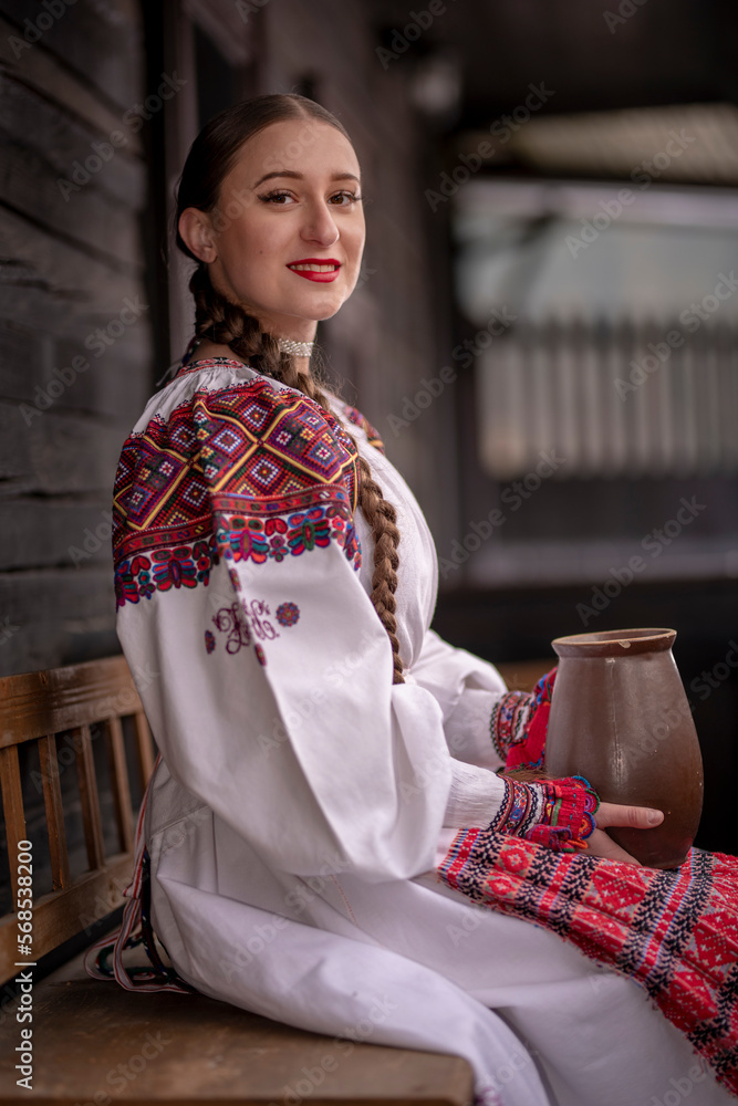 Young beautiful slovak woman in traditional costume. Slovak folklore