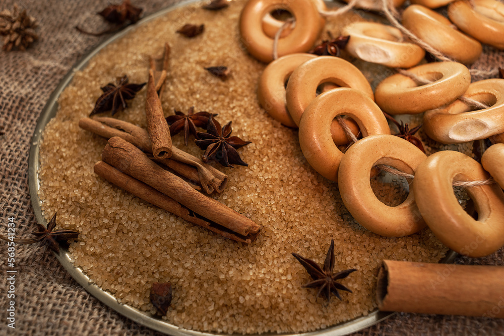 custom made wallpaper toronto digitalA bundle of mutton lies on cane sugar, next to spices - cinnamon sticks and anise stars. Against the background of coarse burlap. Background for a pastry shop or grocery store