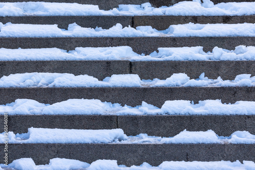 Stone steps with snow and ice background