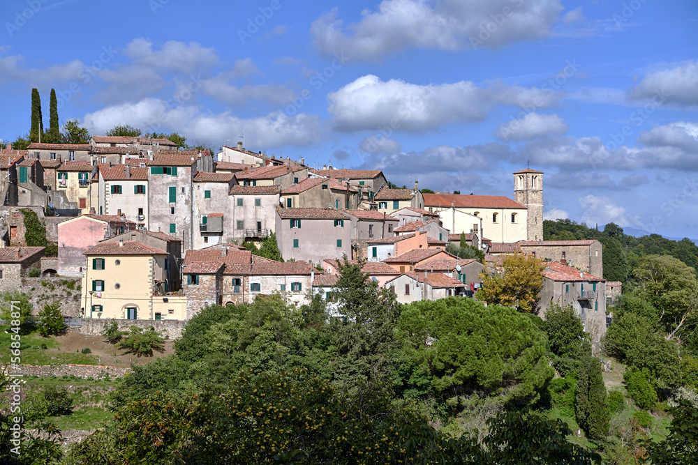 stone houses and medieval church tower in Scansano village in Tuscany stone houses and medieval church tower in Scansano village in Tuscany