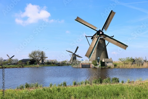 windmills in holland at the river