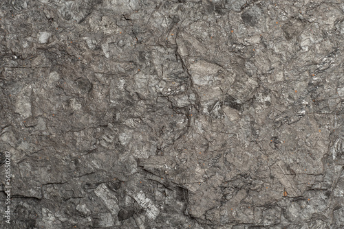 Full frame of black coal rock texture. Non-renewable power source. Natural heating fuel