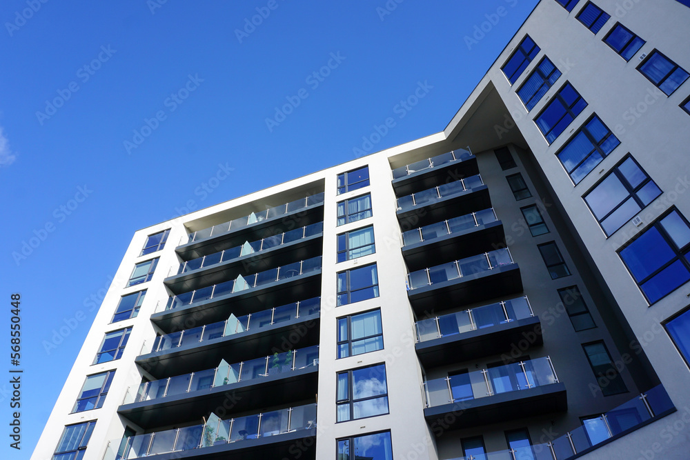 modern apartment building under blue sky. real estate image with copy space modern apartment building under blue sky. real estate image with copy space