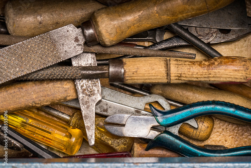 Vintage toolbox open with old grunge tools inside