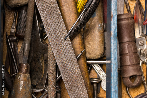 Vintage toolbox open with old grunge tools inside