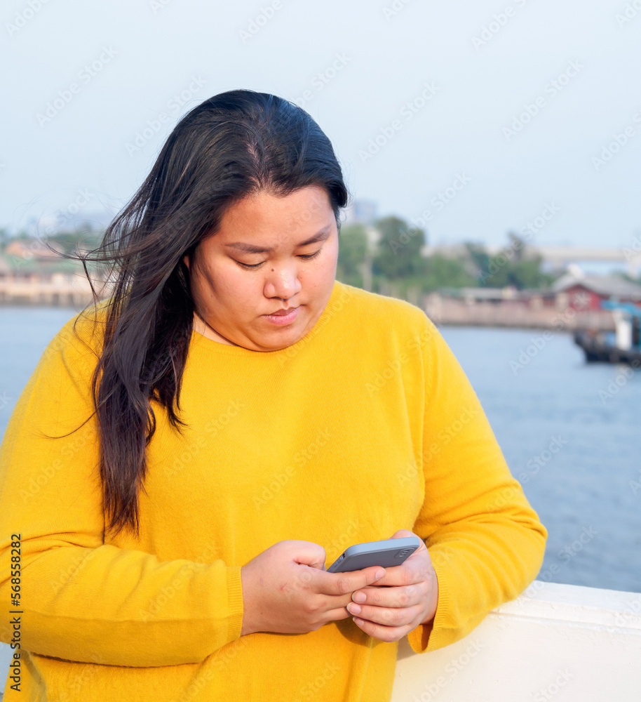 Portrait Fat Asian Woman Long Black Hair Wearing Yellow Shirt Are Using Mobile Phone Or 