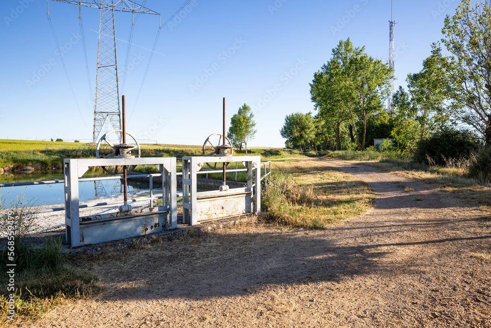 sluicegates in the Canal de Castilla - Ramal de Campos next to Medina de Rioseco, province of Valladolid, Castile and Leon, Spain sluicegates in the Canal de Castilla - Ramal de Campos next to Medina de Rioseco, province of Valladolid, Castile and Leon, Spain