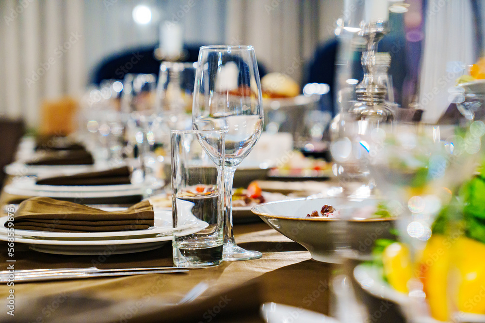 Fototapeta premium a festive served table with snacks and tableware.