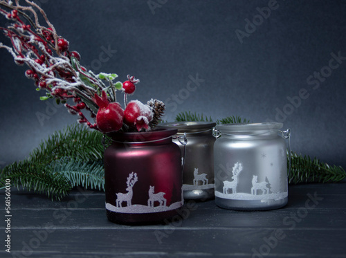 Christmas decor for the background. Candlesticks and candles. Tree branches. Winter apples. Decor for decoration.