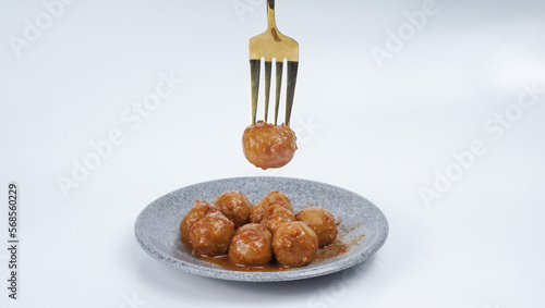 Cilok on a fork isolated over white background. Cilok is a traditional food that comes from West Java Indonesia
