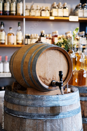 Wooden barrel with wine or alcoholic drink in the store.