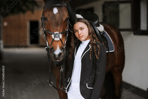 Rider and horse go to the country after the race. Outdoor shot, sport and fashion concept.