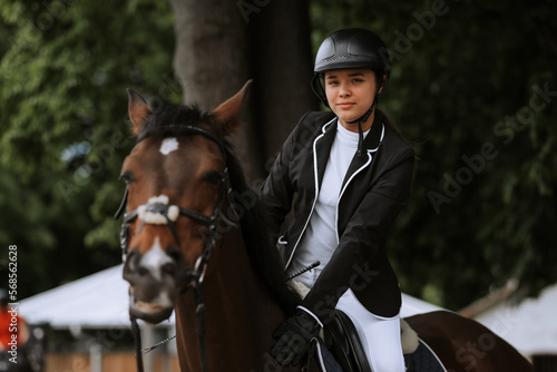 The sportswoman on a horse. The horsewoman on a horse. Equestrianism.  Horse racing. Rider on a horse. © JJ Studio