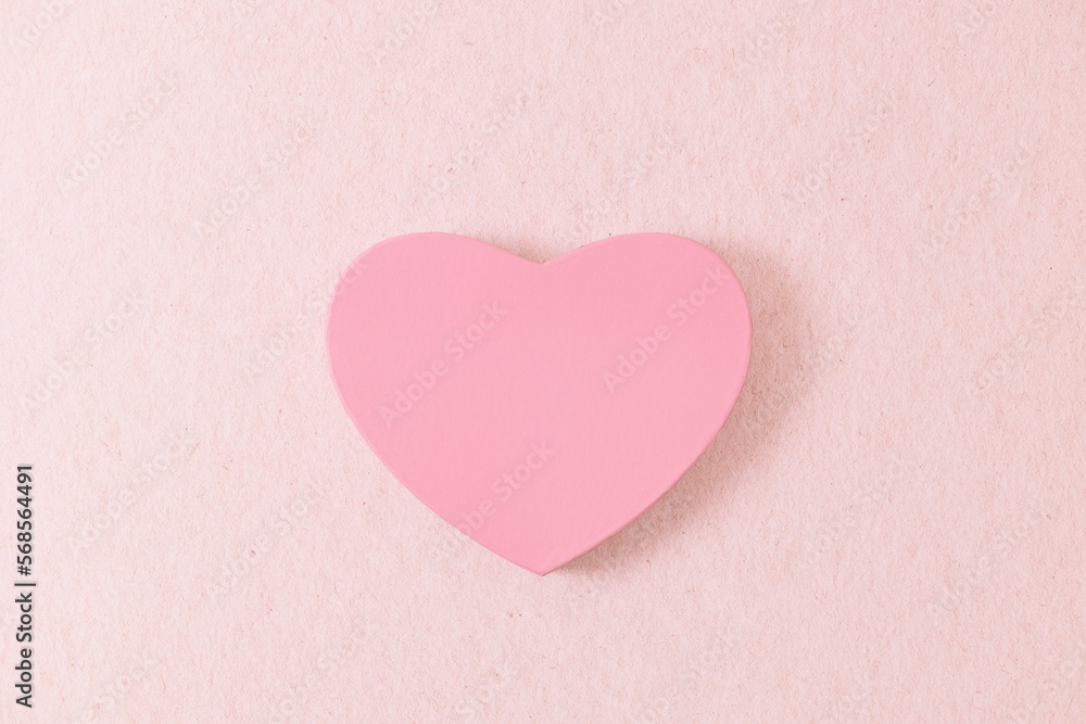 One heart gift box on a pink background.