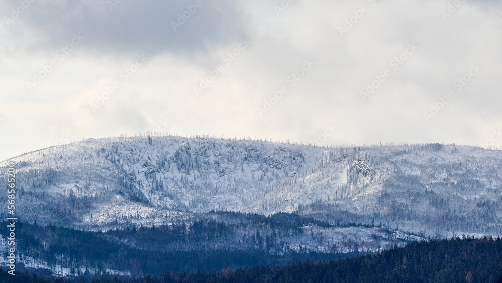 Countryside mountain winter landscape with snow.