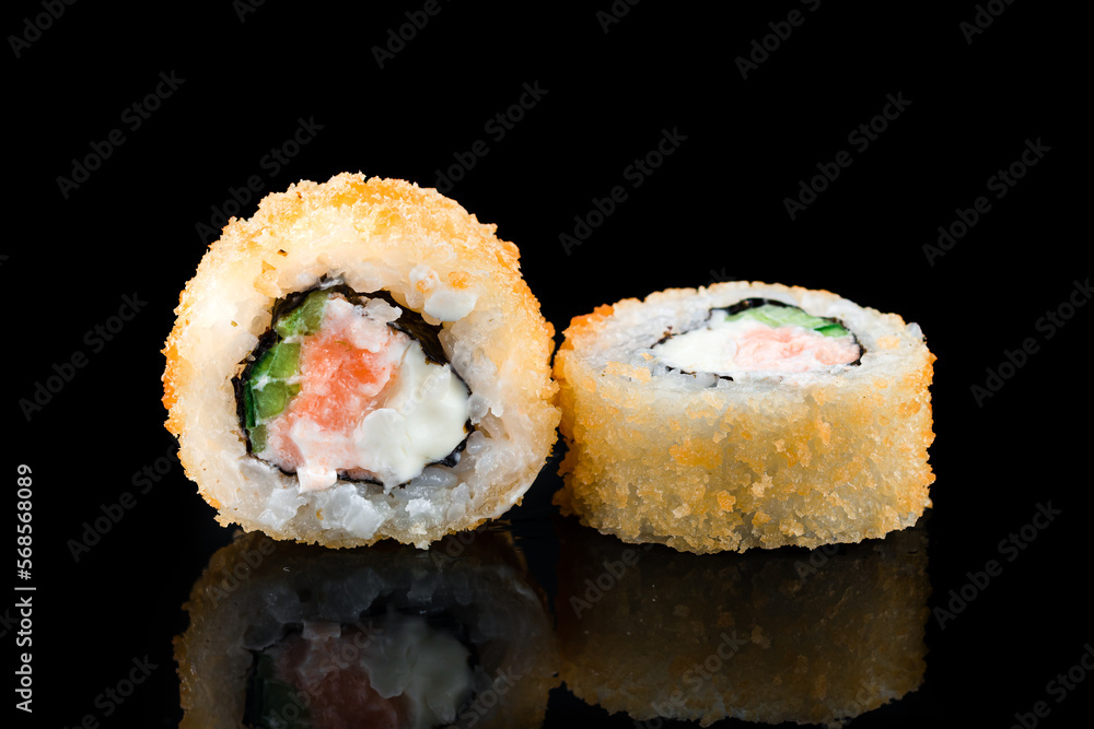 Japanese tempura maki sushi rolls with salmon, cream cheese and cucumber. Japanese tempura maki sushi rolls with salmon, cream cheese and cucumber.