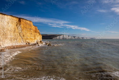 The Seven Sisters are a series of chalk sea cliffs on the English Channel coast, and are a stretch of the sea-eroded section of the South Downs range of hills, in the county of East Sussex