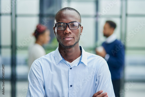 Happy african american young businessman in formal suit wearing eyeglasses portrait.