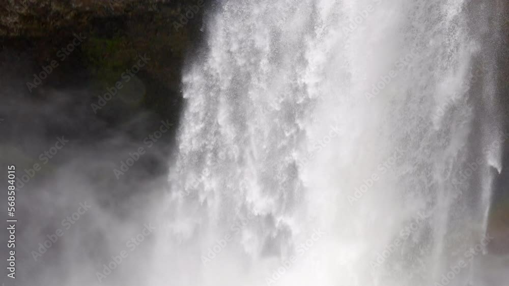 Establishing shot of majestic mountain waterfall with mountain background in Vancouver, Canada, North America. Day time on July 2022. Still camera view. ProRes 422 HQ. Establishing shot of majestic mountain waterfall with mountain background in Vancouver, Canada, North America. Day time on July 2022. Still camera view. ProRes 422 HQ.