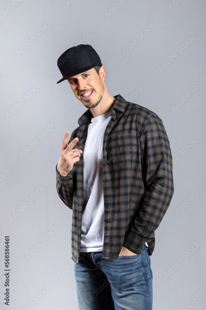 Man in casual clothes posing looking at camera isolated on gray background Man in casual clothes posing looking at camera isolated on gray background