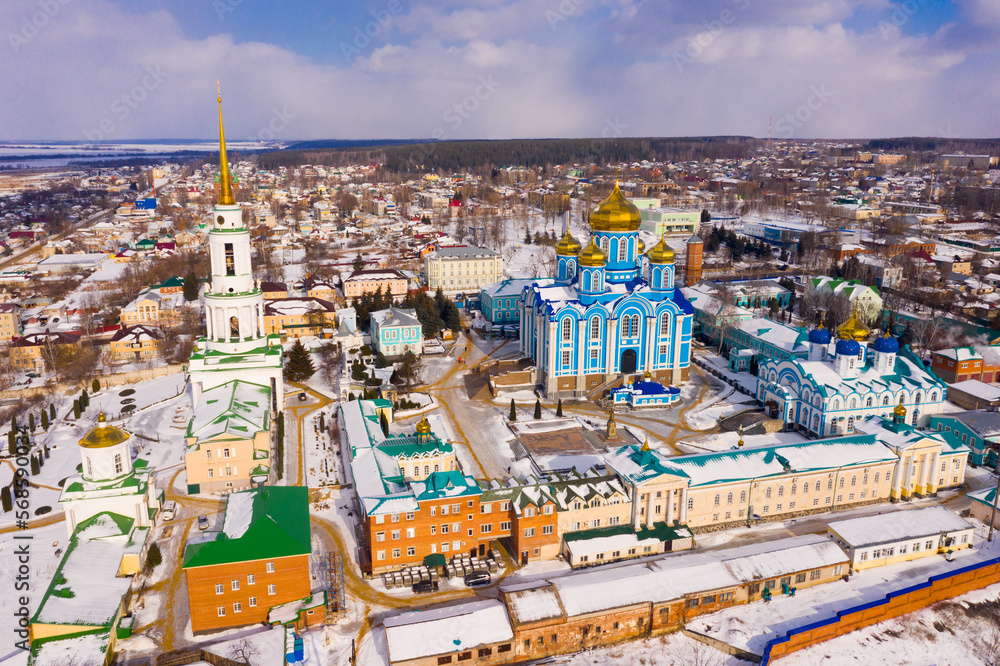 Aerial panoramic view of architectural complex of Nativity of Mother of God Monastery in small Russian town of Zadonsk on winter day..