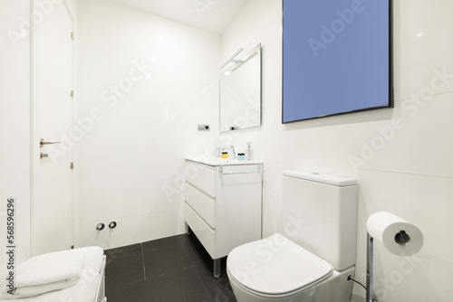 Wallpaper Mural Bathroom with white wooden furniture with drawers, square mirror with lamp on the wall and white porcelain toilets Torontodigital.ca