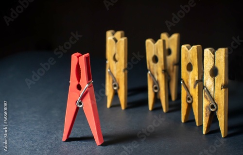 The concept of leadership. Stand out from the crowd, team leadership, a brave and confident person with influence, a speaker, one against the crowd, not like everyone else. Selective focus.