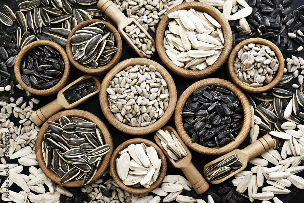 Varieties of sunflower seeds and dehulled kernels, food ingredients, healthy snacks Varieties of sunflower seeds and dehulled kernels, food ingredients, healthy snacks