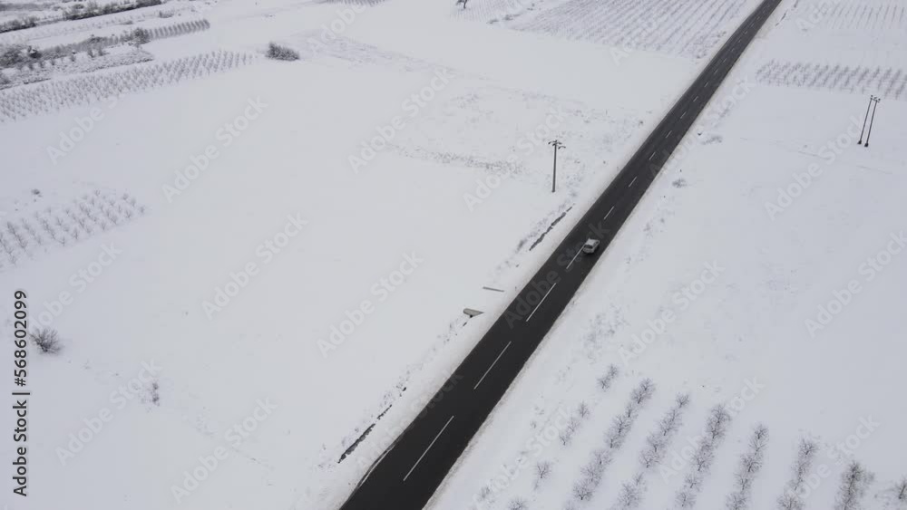 Car drive in snow winter day on the road in with snow aerial view Car drive in snow winter day on the road in with snow aerial view
