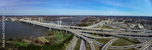 The junction of highways in downtown Louisville, KY, which connects to bridges towards Indiana over the Kentucky River, experiences light traffic during mid-day.