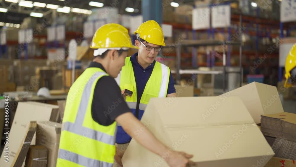 Teamwork of Asian workers working in large warehouse store industry.Rack of stock storage. Interior of cargo in ecommerce and logistic concept. Depot. People lifestyle. Shipment service for container Teamwork of Asian workers working in large warehouse store industry.Rack of stock storage. Interior of cargo in ecommerce and logistic concept. Depot. People lifestyle. Shipment service for container