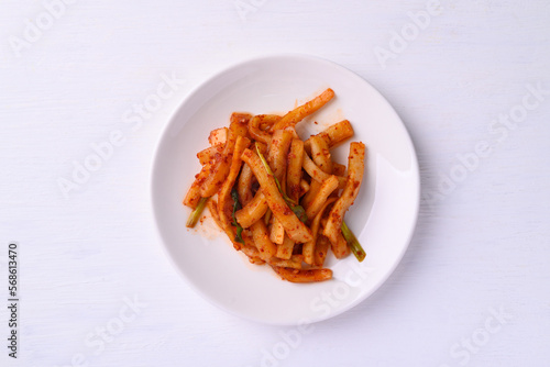 Kimchi radish on white background, Korean food homemade side dish, Top view