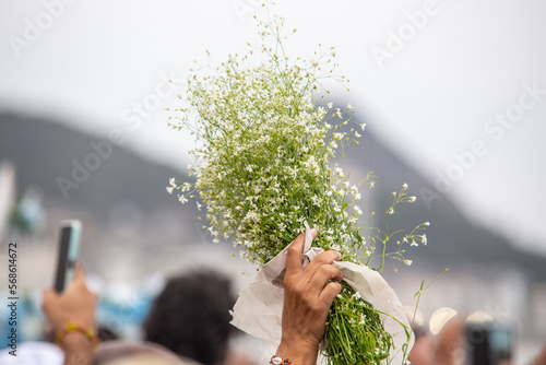 flowers in honor of iemanja, during a party at copacabana beach in Brazil. photo