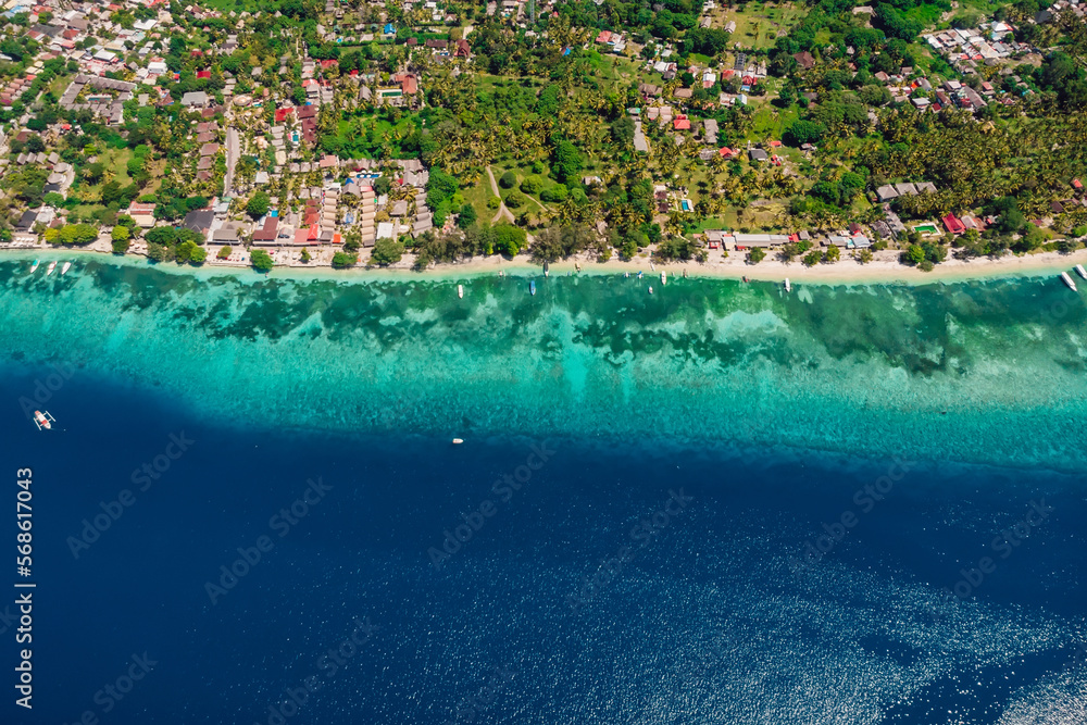 Gili Air island with beach and blue ocean, aerial view. Holiday islands in Indonesia
