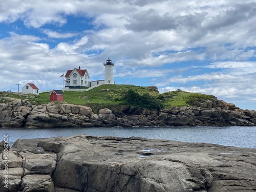 scenic lighthouse in Maine with dramatic sky in the background