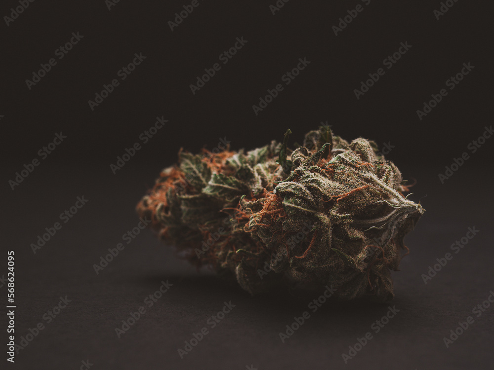 Dry cannabis buds on a black background Dry cannabis buds on a black background