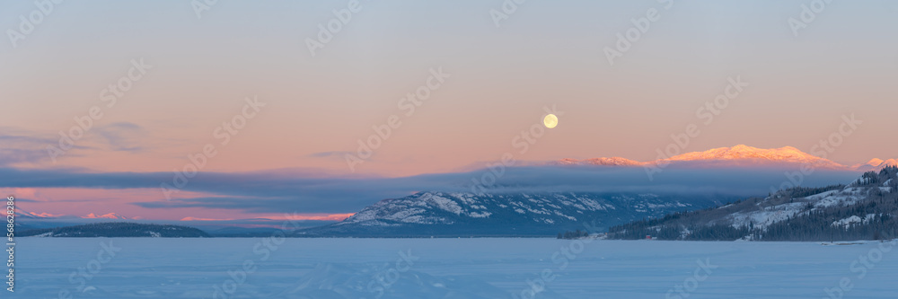 Incredible sunset views in winter season from northern Canada with bright pink clouds, mountains and snow at dusk. Incredible sunset views in winter season from northern Canada with bright pink clouds, mountains and snow at dusk.