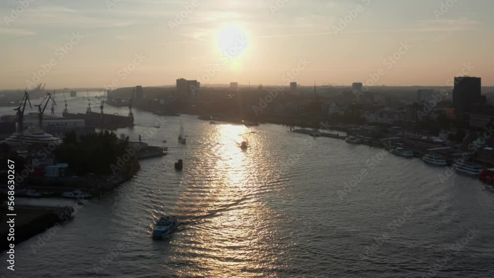 Hamburg Harbour at Golden Hour with sun and Russian Yacht in the shot during Hamburg Cruise Days Hamburg Harbour at Golden Hour with sun and Russian Yacht in the shot during Hamburg Cruise Days