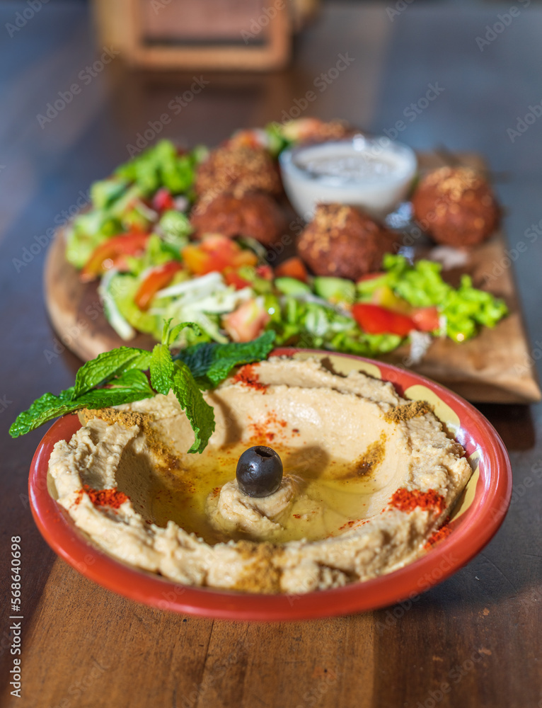 Delicious falafel plate on a wooden table, Delicious falafel plate on a wooden table,