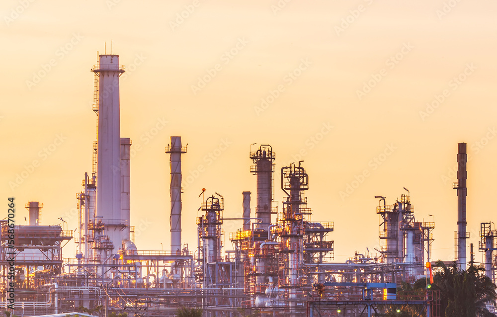 Panorama of oil refinery with petrochemical plant.Gas refinery with colorful twilight at sunrise time.Copy space with orange background.