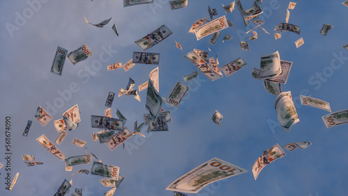 Banknotes falling from the Sky. One Hundred Dollar Bills against Morning Sky backdrop. Prosperity concept. photo